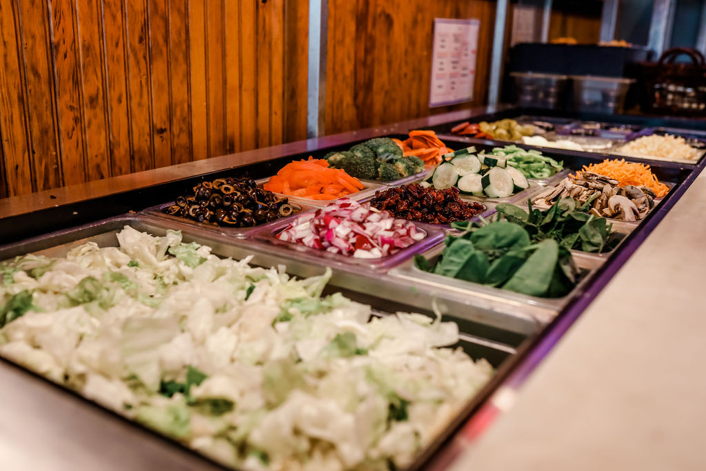 salad bar with a variety of toppings